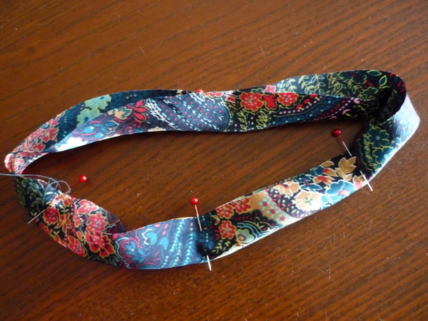pin edges of neck binding together, matching notches