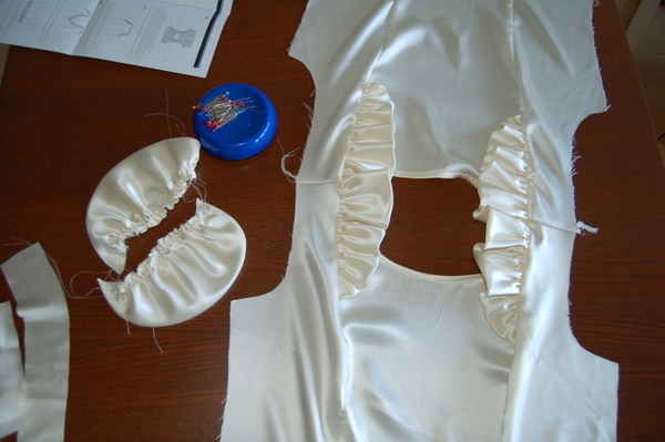 open up the blouse flat, with the right side facing you