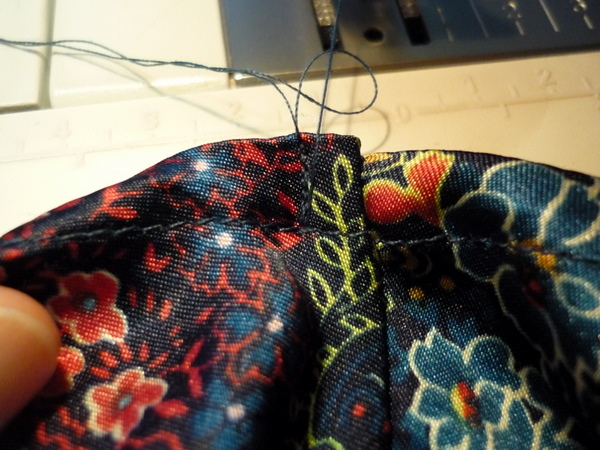 tack armhole seam allowances to the back