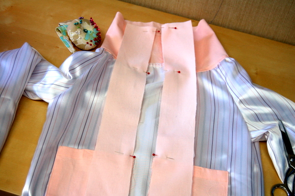pin and sew plackets to front of lining