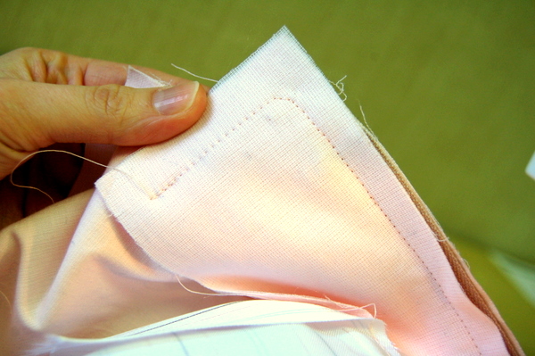 take one or two diagonal stitches across the corner