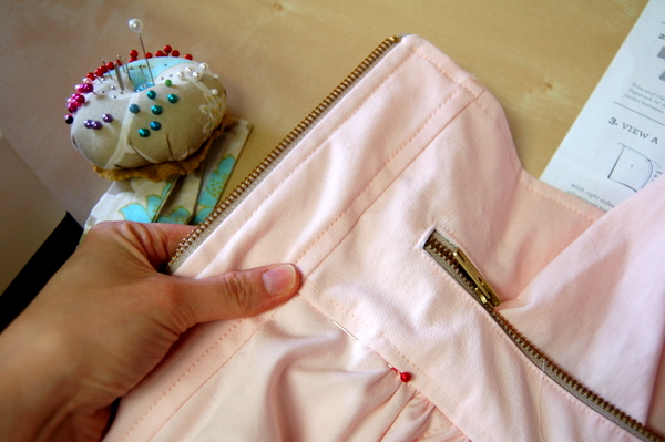 line up the neckline seam on both layers and pin